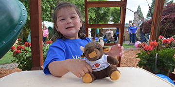 Three year-old Alicia with a PrimeLending Bison stuffed animal